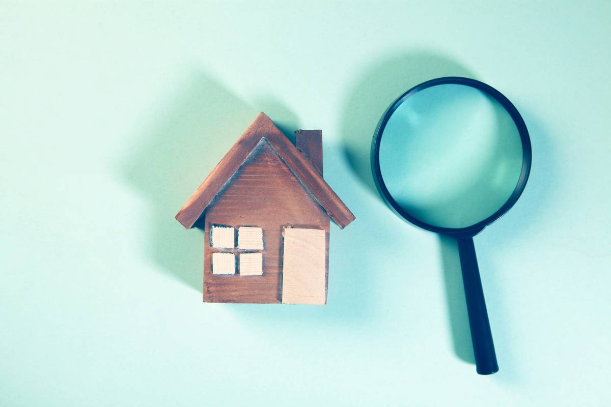Homeowner documenting hail damage for hail claim process guide