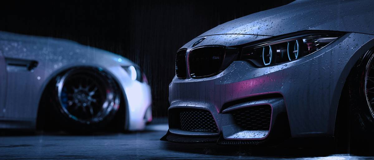two cars parked side by side in a garage